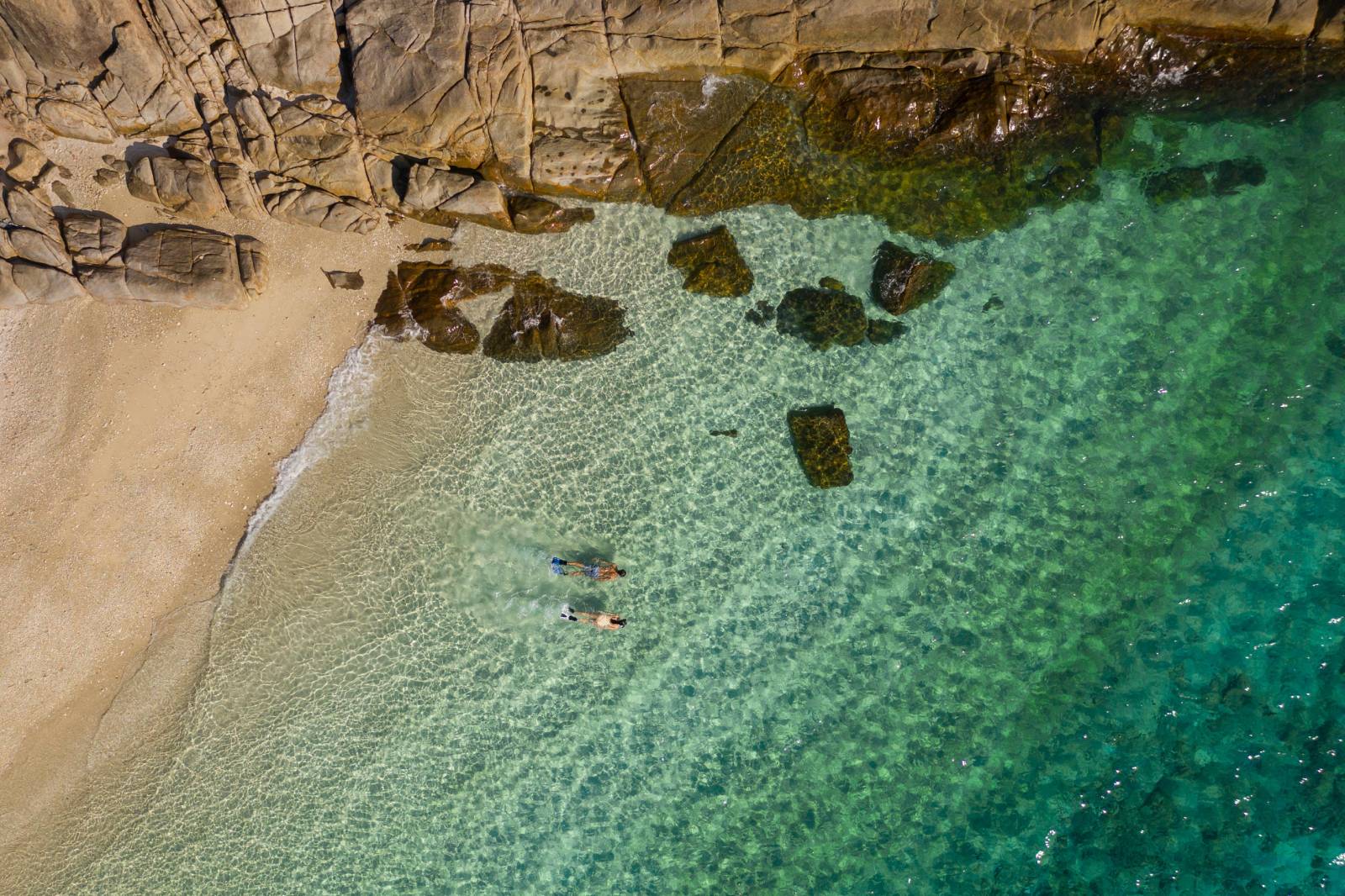 couple snorkeling in the blue ocean of Con Dao