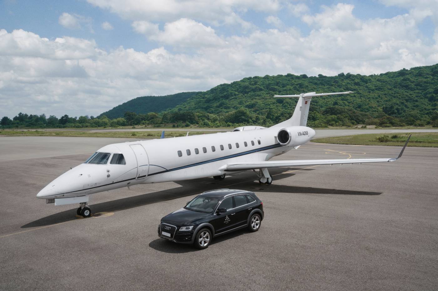 Six Senses Con Dao's car next to a private jet